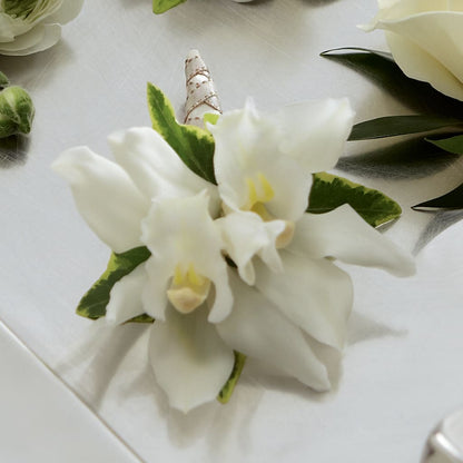 White Mini Cymbidium Boutonniere –  United Floral Svc Inc, Philadelphia PA